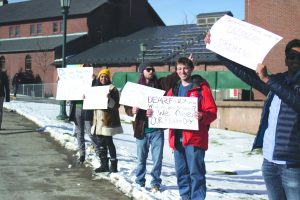 Students protest the removal of reading days outside Bailey/Howe Library Jan. 25. One of the students’ signs read, “Dear Faculty Senate, what are you smoking?” OLIVER POMAZI/The Vermont Cynic