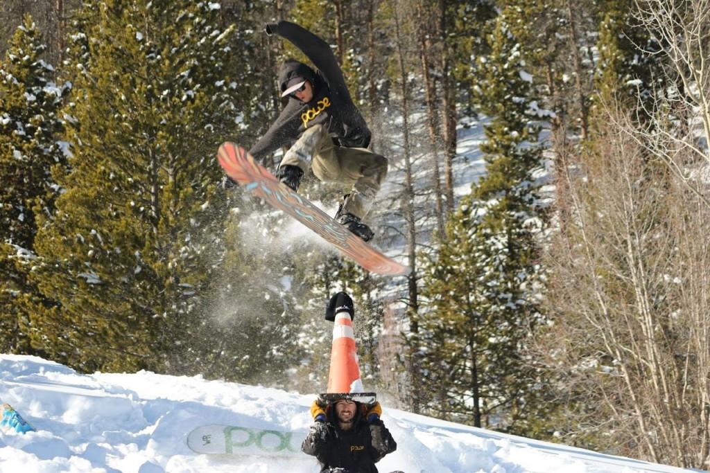 A snowboarder wearing Powe products hits a jump last winter with Powe’s snowboard the “Vt. Chedda Shredda,” Powe currently offers five snowboards on their website, with three only available for pre-order in anticipation of this year’s season. PHOTO COURTESY OF POWE SNOWBOARDS