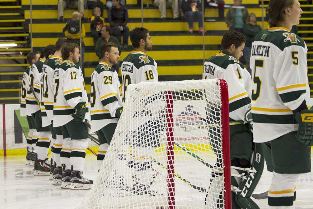 The men’s hockey team lines up before their Oct. 4. exhibition game against Acadia University. DAYNA WYCKOFF/The Vermont Cynic
