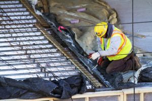 A construction worker makes progress on the new STEM Lab Building Nov. 23. The construction of the building is scheduled to be completed by May 2019. STU LAPERLE/The Vermont Cynic