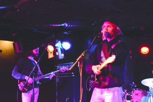 Self-described nomadic disco punk trio Bison performs at Battle of the Bands March 18. The group won the chance to be the opening act at SpringFest. Jen Ramirez/The Vermont Cynic